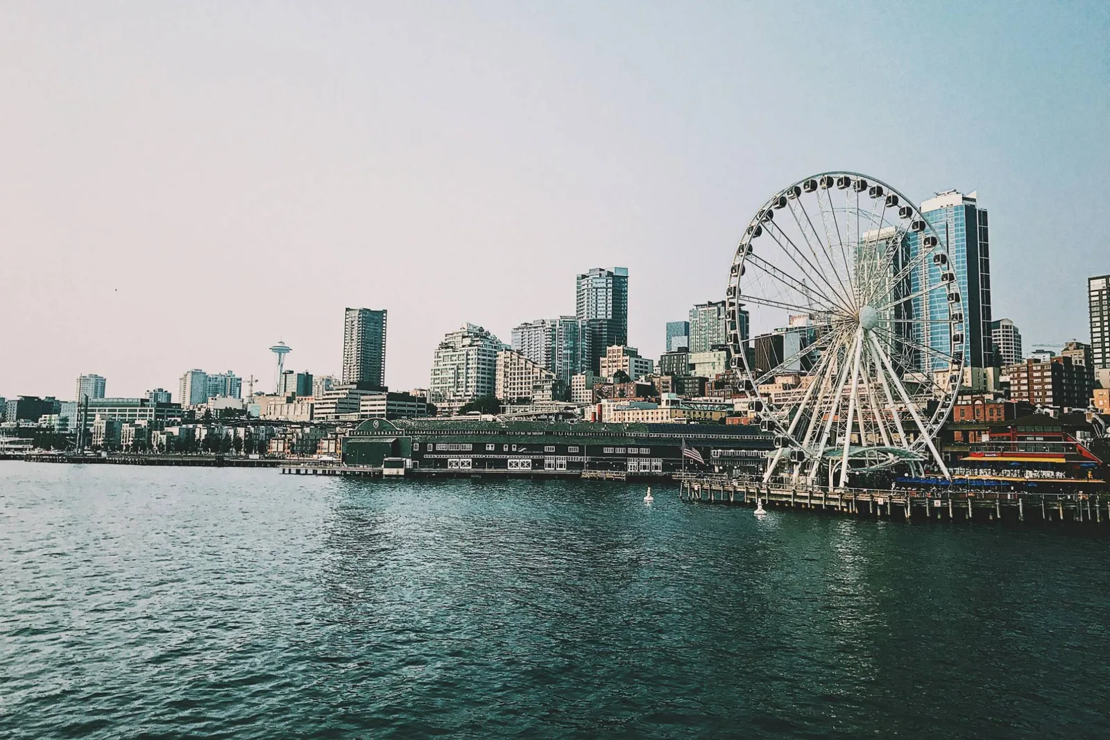 The Seattle waterfront seen from Elliott Bay, with the Great Wheel, downtown towers and the Space Needle